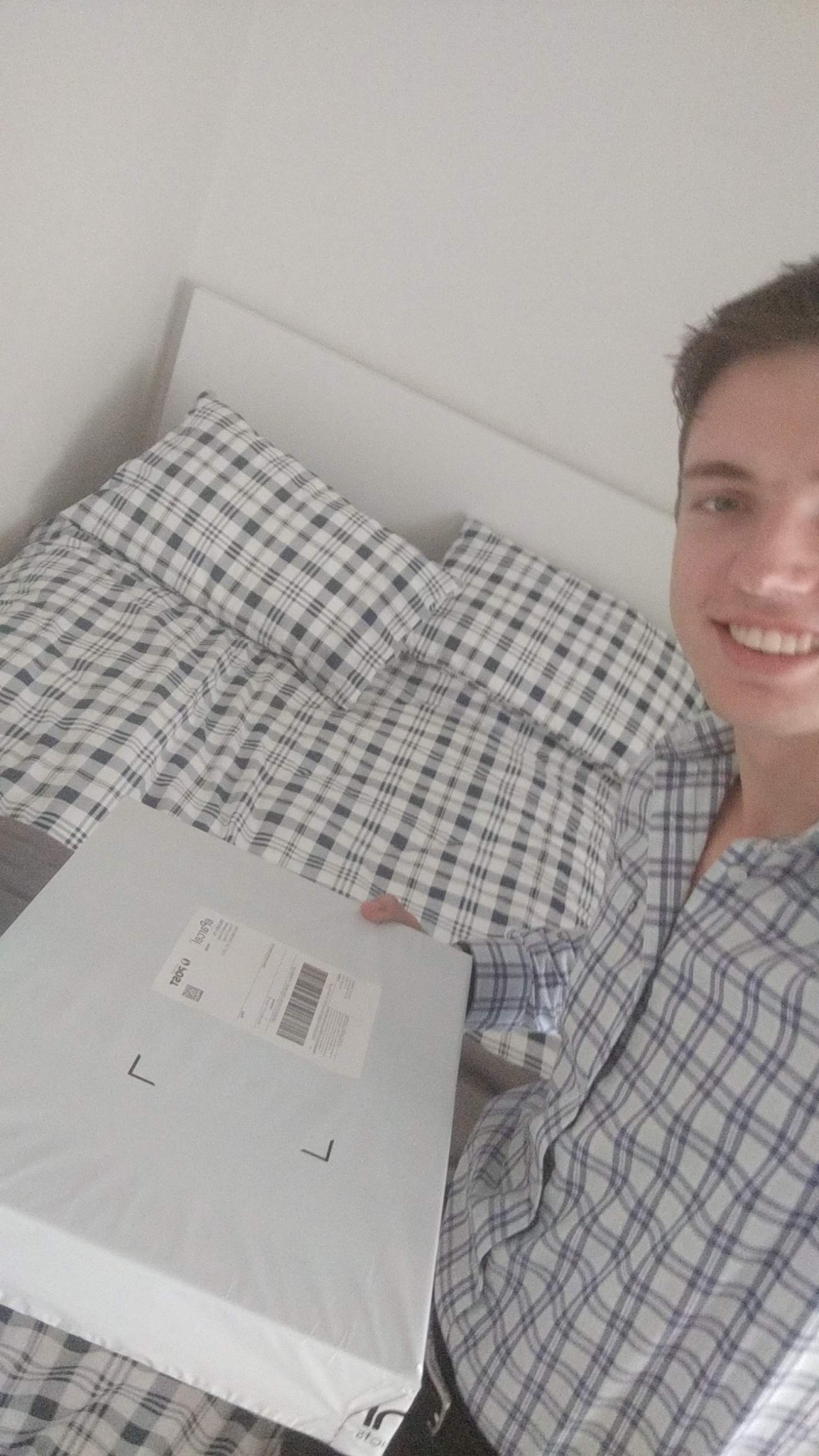 Opening a present in Melbourne - matching shirt and sheets! - 12th of Feb